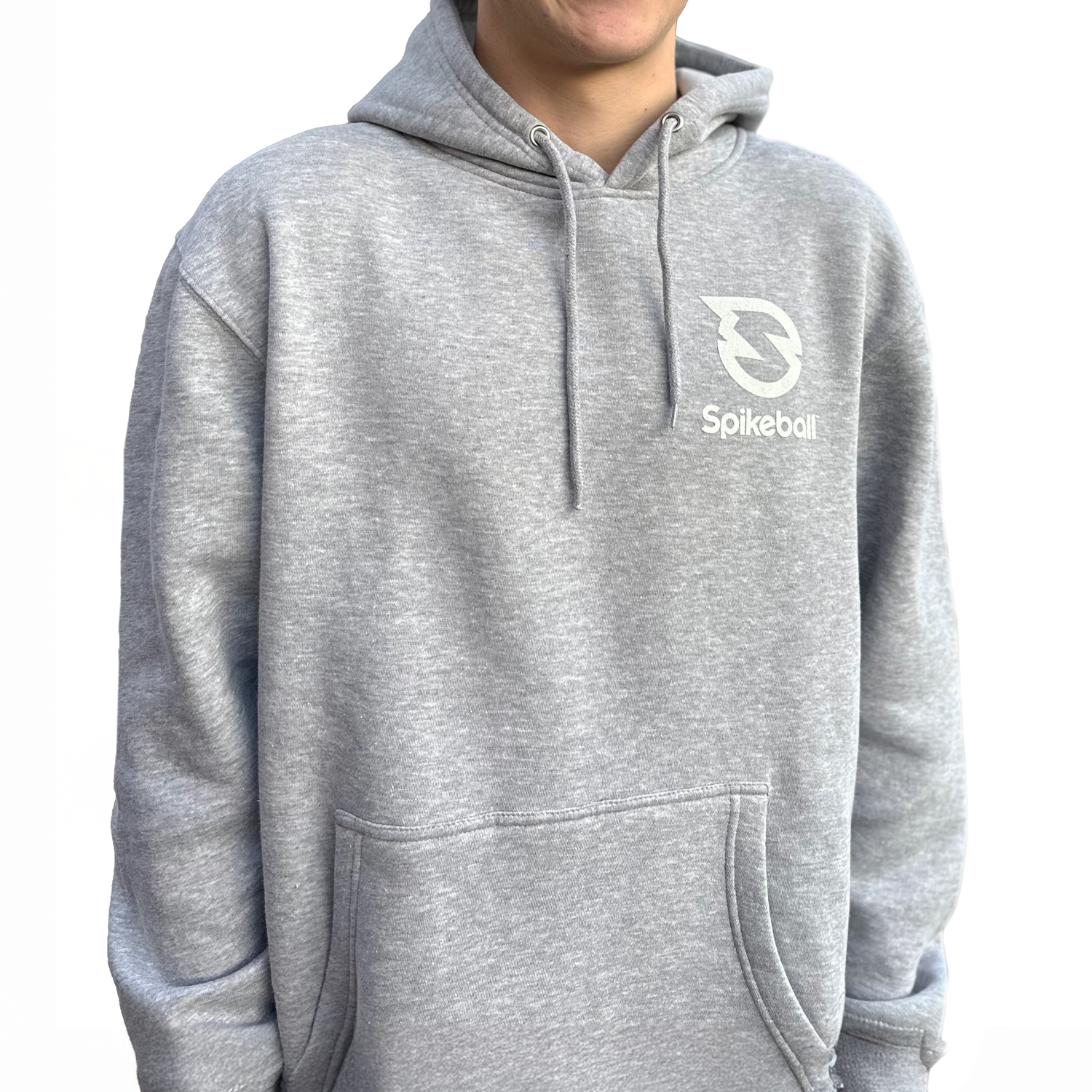 A person wearing a gray hoodie with the 'Spikeball' logo on the front.