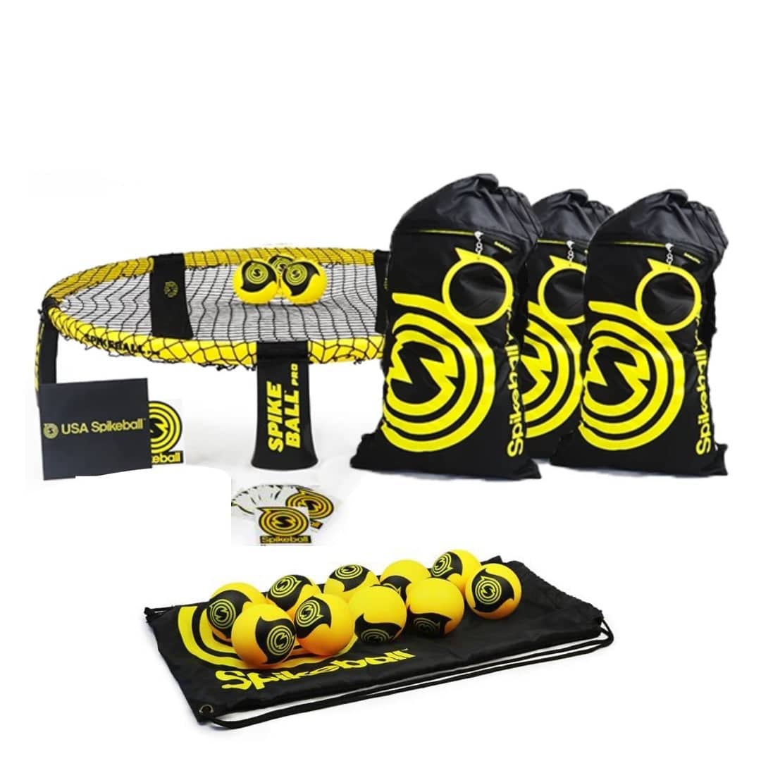 The image shows a spikeball set which includes black and yellow Spikeball branded bags, a black and yellow net, yellow and orange Spikeball branded balls, and a black and yellow carrying case.